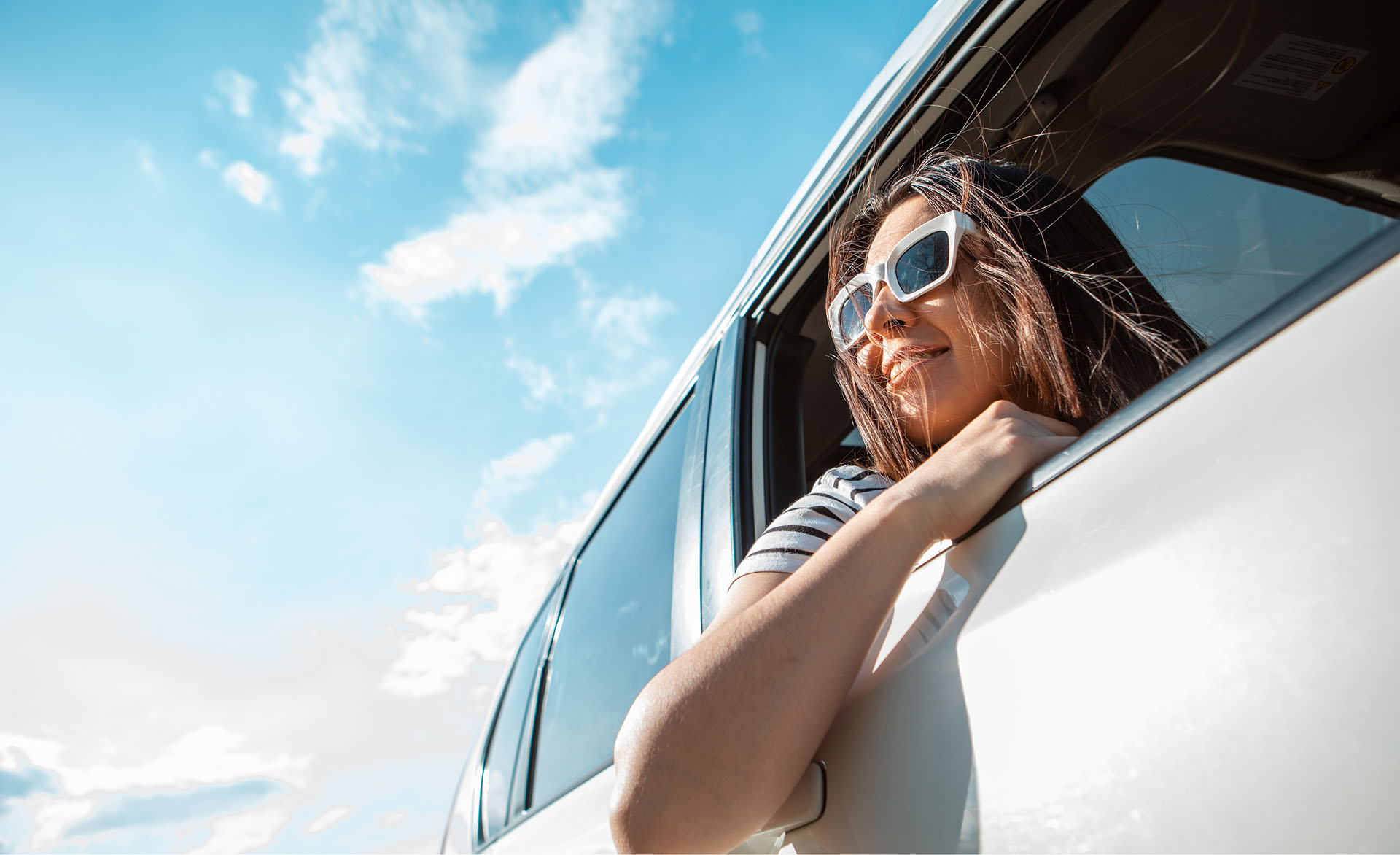 Autowize Chania Car Rental picture of relaxed woman looking out the window